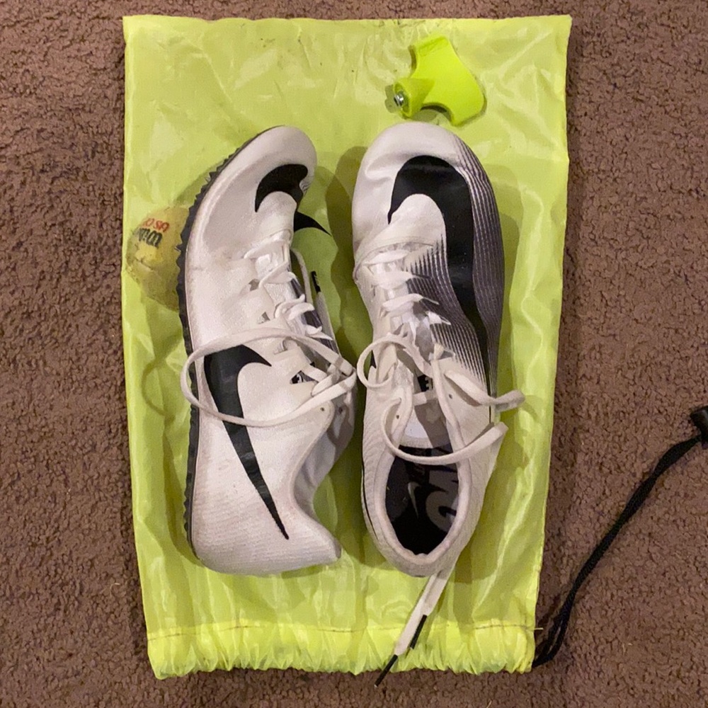 White/grey Nike track shoes. Size 10. Has spikes